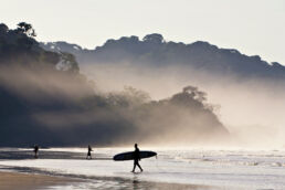 Sunrise surfing in Dominical, Costa Rica.