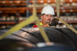 Loading a large pipe at the Wolseyley Industrial Group, Industrial photography Lakeland, Florida by Tampa based commercial photographer Carver Mostardi.