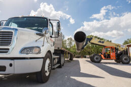 Loading a large pipe for shipment at the Wolseyley Industrial Group, Industrial photography Lakeland, Florida by Tampa based commercial photographer Carver Mostardi.