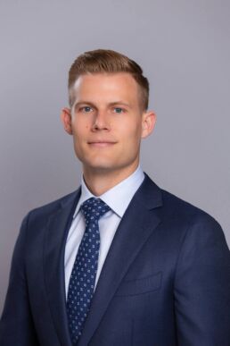 Contemporary business headshot of young executive in suit and tie photographed on location in Clearwater, Fl.