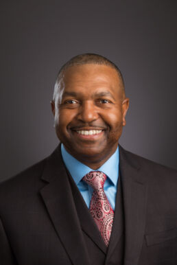 Formal portrait of African American business man in suit and tie on location in his Sarasota, Fl office.