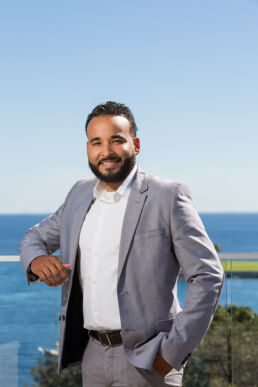 Environmental portrait of hispanic executive with view of Tampa Bay from the Rooftop in St. Petersburg, Fl.