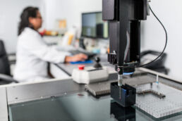 Lab tech performing quality control tests at product manufacturing laboratory at Seaway Plastics in central Florida.